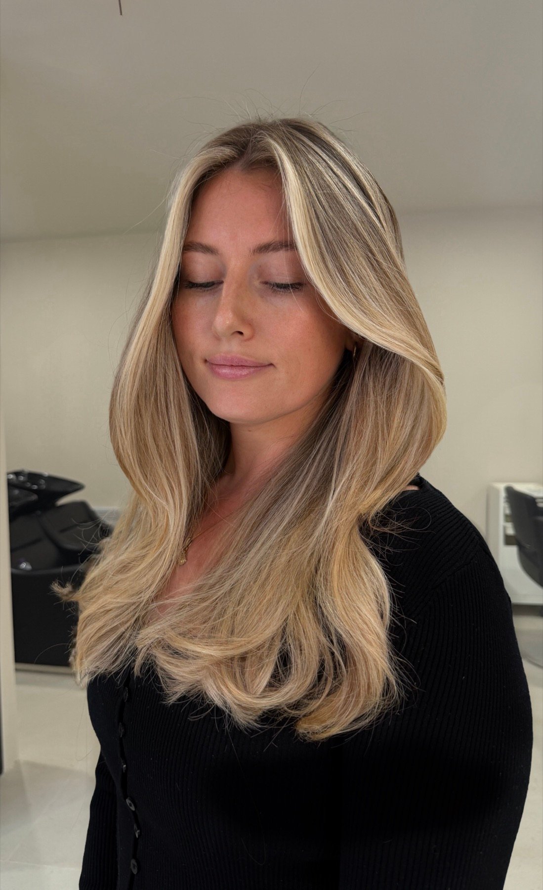 Soft layered blonde with face-framing pieces